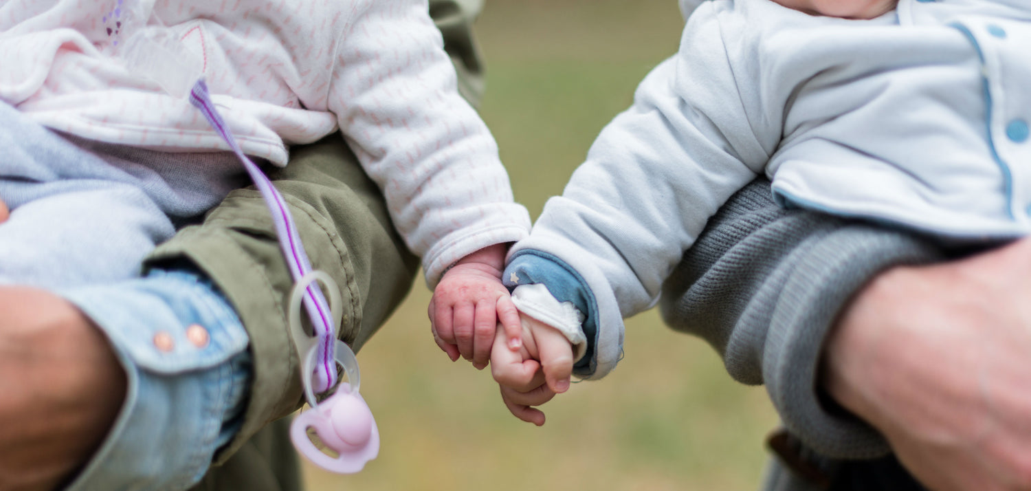 Family - two children holding hands