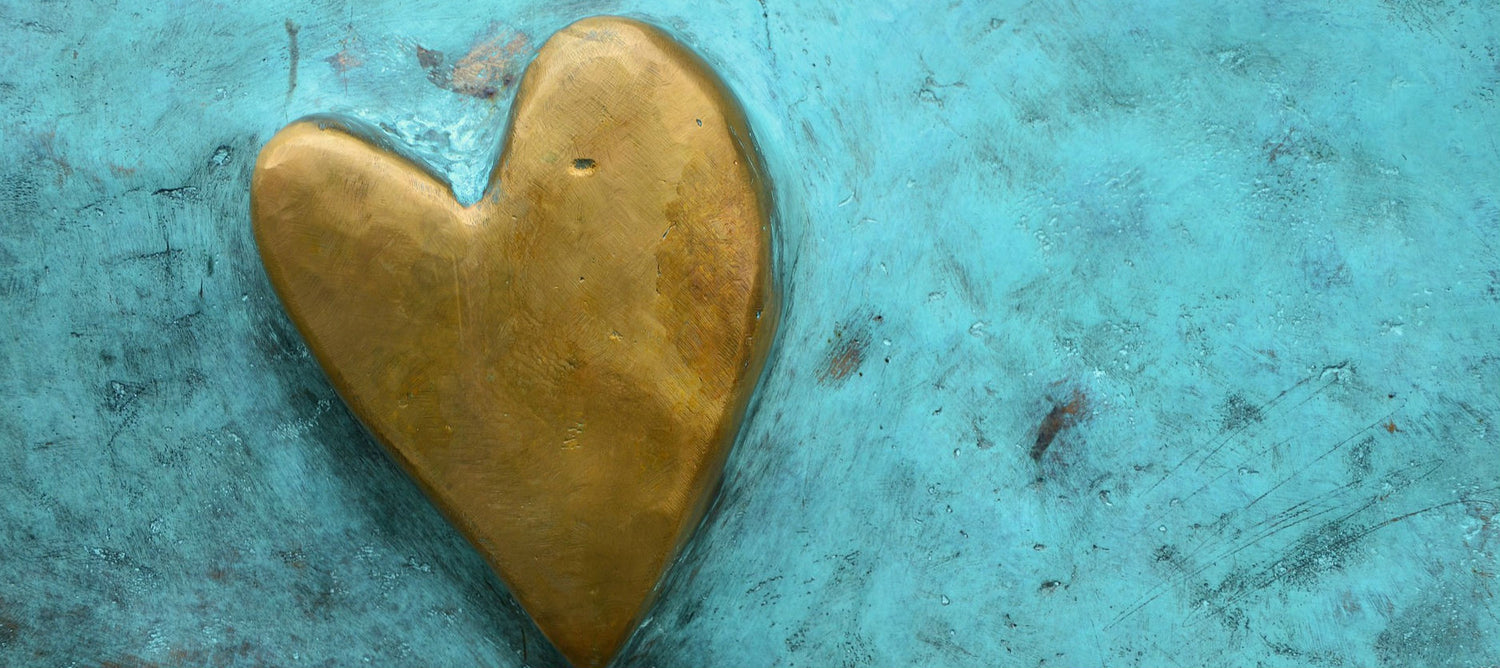 Gold heart on a blue background