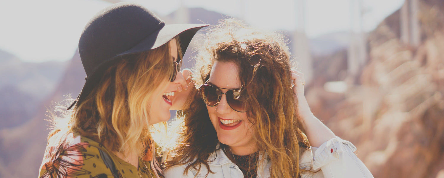 Two friends looking happy and thankful together