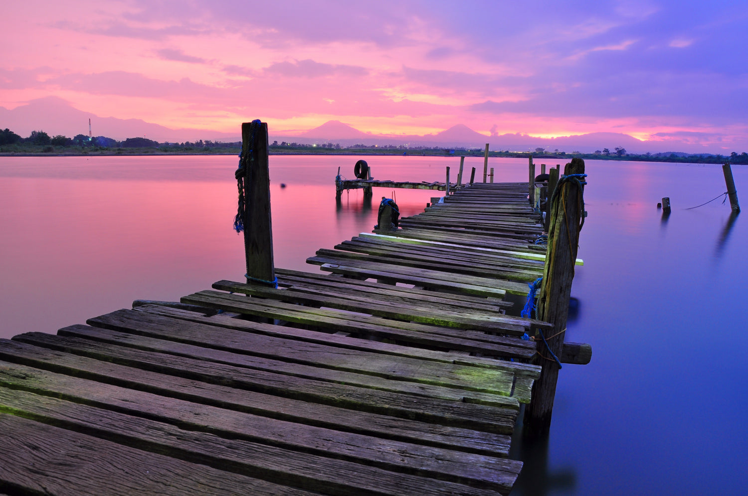 A boardwalk leading out to a lake