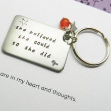 Graduation Keyring hand stamped with "She believed she could, so she did'