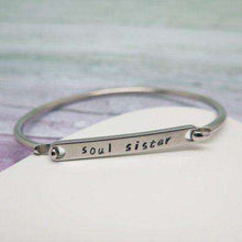 Personalised bangle with 'soul sister' hand stamped on it